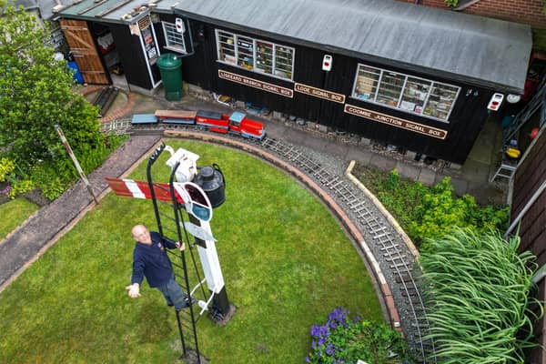 Derek Burwell, 83, spends 30 years building miniature railway in garden.