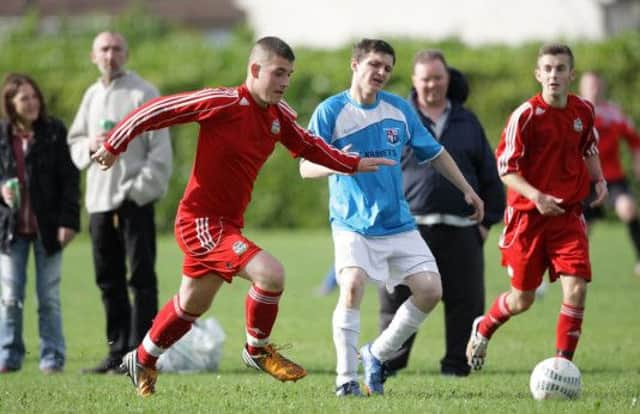 Action from the game between Lambeg Rangers and Ballymacash, at Barbour Playing Fields. US1441-509cd  Picture: Cliff Donaldson